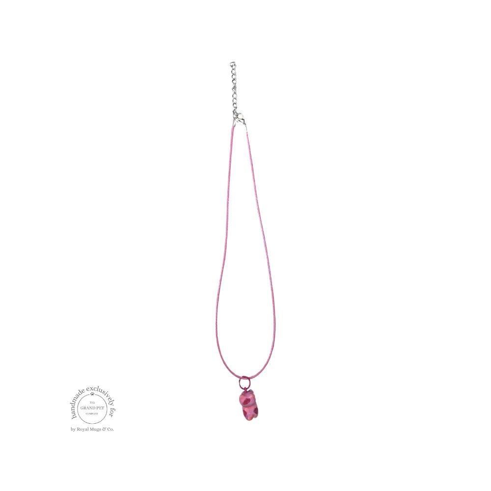 A pink dotted necklace or cats with a lobster clasp