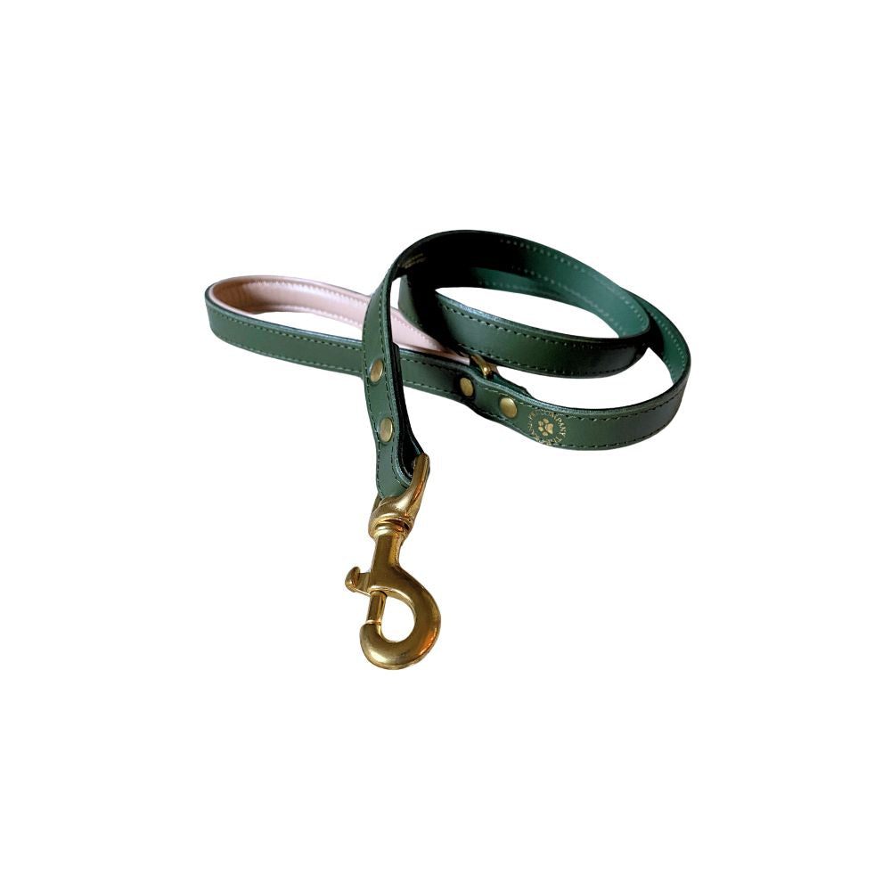 A green padded leather dog lead with brass hardware and an embossed The Grand Pet Company logo.