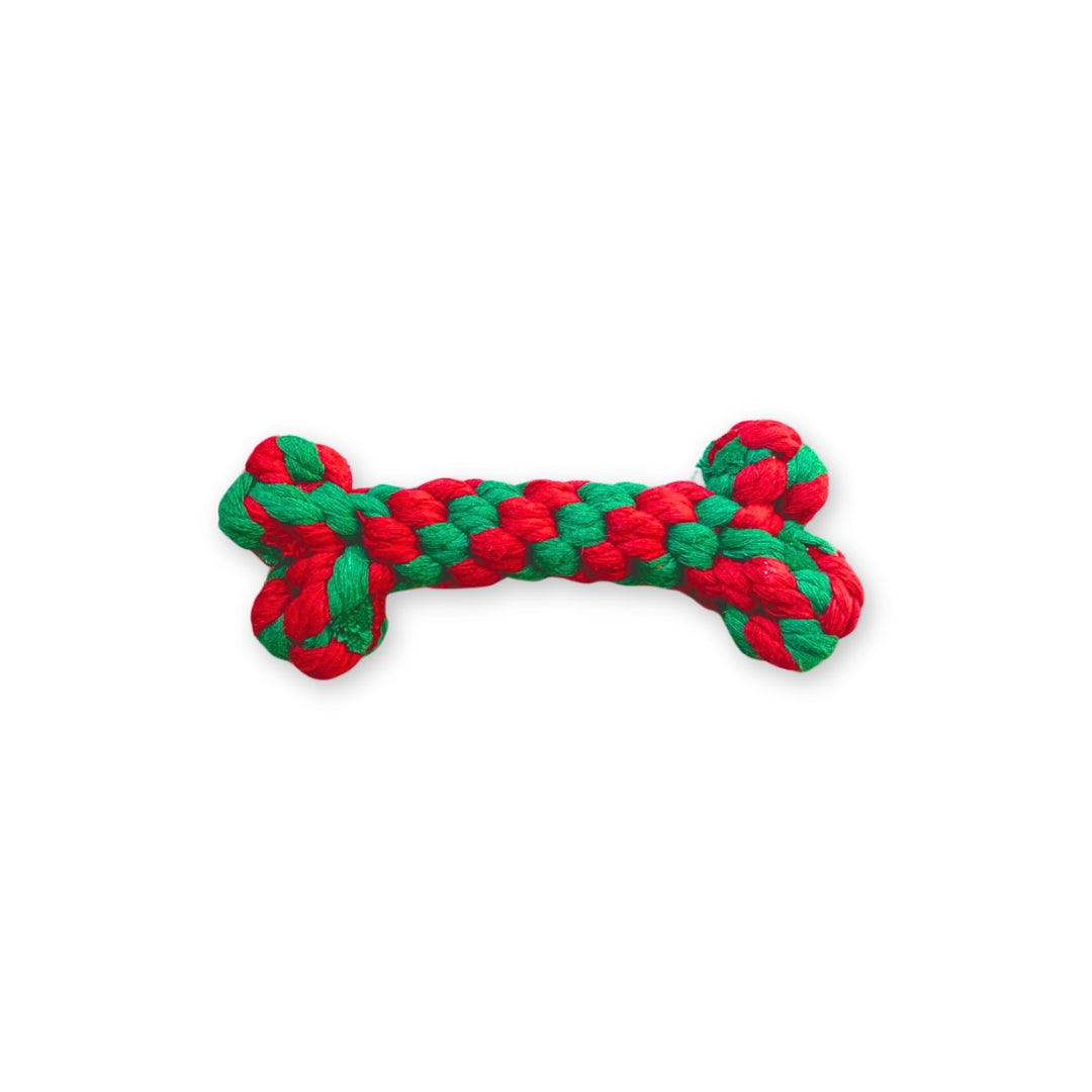 A red and green weaved rope toy for dogs, shaped like a bone