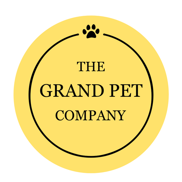 The Grand Pet Company logo featuring a paw print in a circular yellow design
