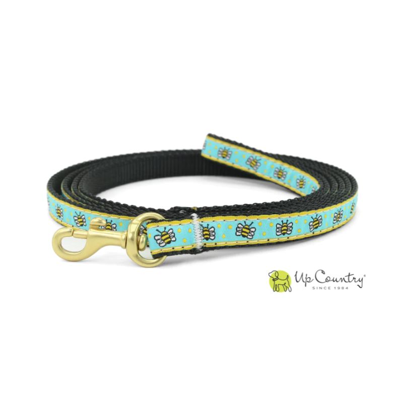 Dog leash with bee pattern on a blue background