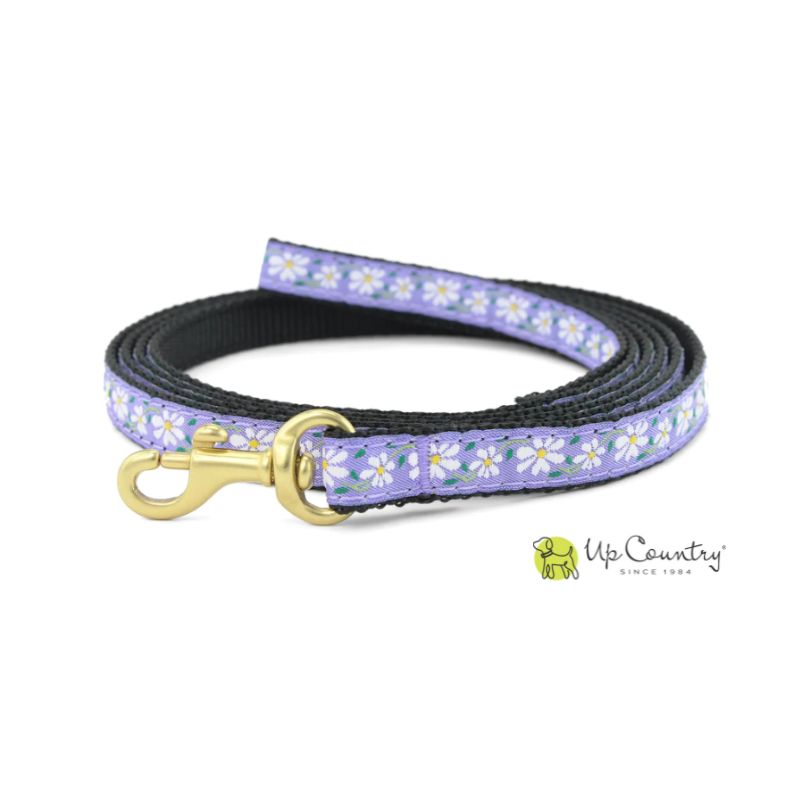Dog leash with white and purple floral pattern and gold clasp on a white background