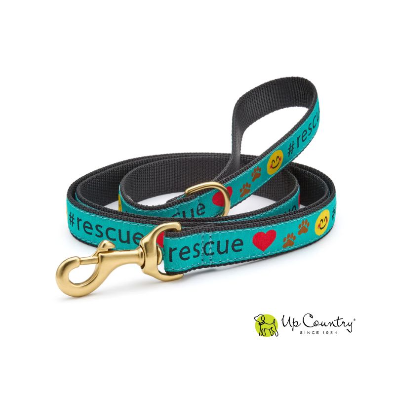 Dog leash with '#rescue' text on a blue background with brass hardware and Up Country logo on a white background