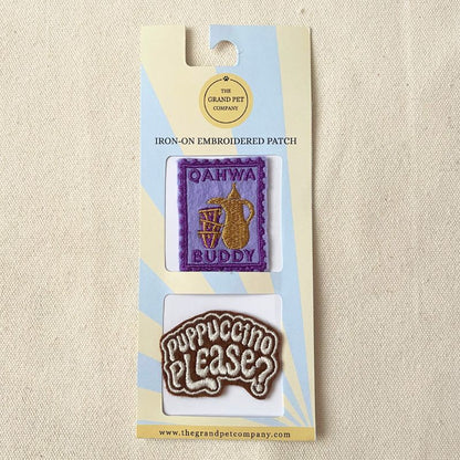 Two colourful iron on embroidered felt patches with coffee theme on packaging with 'The Grand Pet Company' branding.