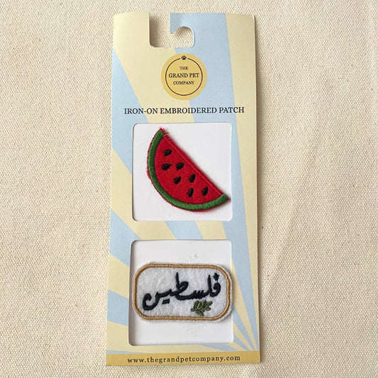 Two iron-on felt embroidered patches with watermelon design and Arabic Palestine text in packaging on a beige background