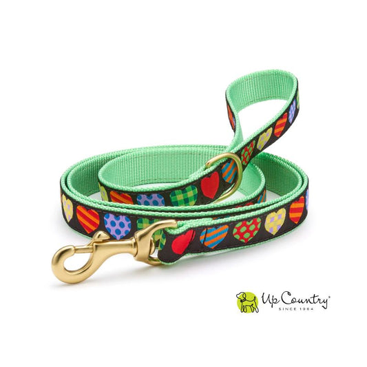 Dog leash with colorful heart pattern and gold clasp on a white background, featuring the 'Up Country' brand.