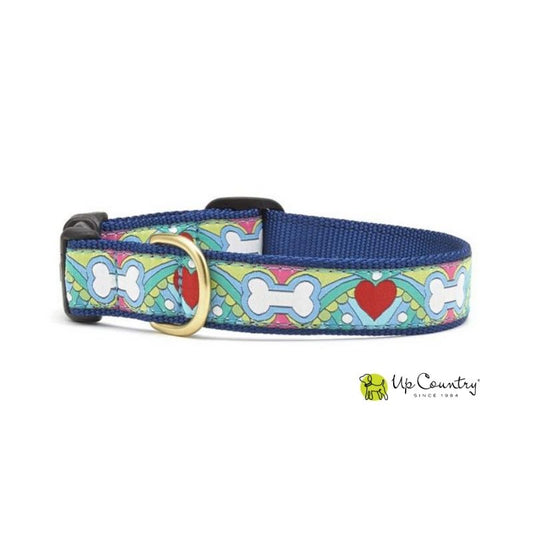 Dog collar with colorful design featuring bones and hearts on a white background, branded 'Up Country'.