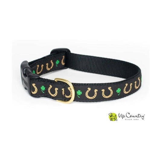 Black dog collar with gold horseshoe and green clover pattern on a white background, featuring the 'Up Country' brand.