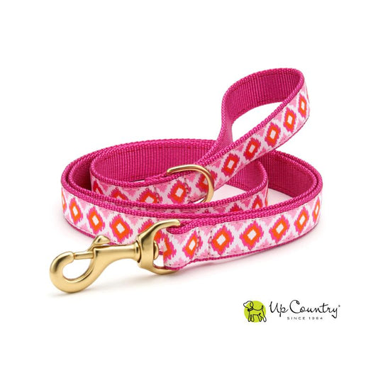 Dog leash with pink and white pattern and gold clasp on a white background, featuring the 'Up Country' brand.