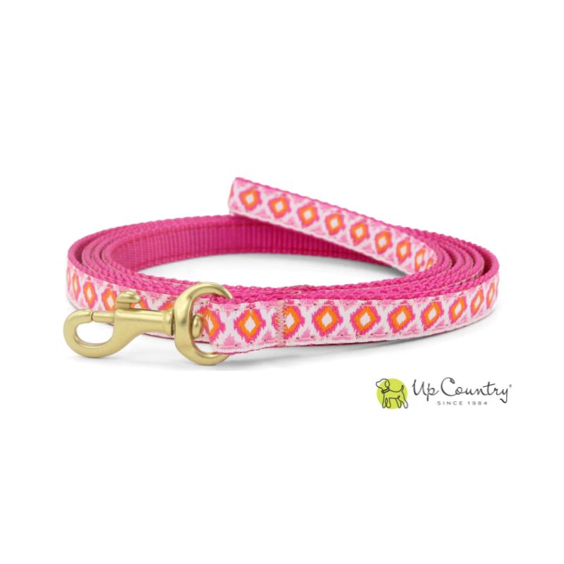 Pink dog leash with diamond pattern and gold clasp on a white background, featuring the 'Up Country' brand.