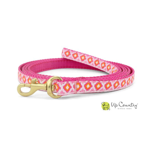 Pink dog leash with diamond pattern and gold clasp on a white background, featuring the 'Up Country' brand.
