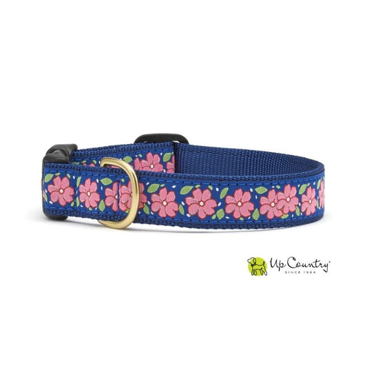 Dog collar with pink floral pattern on a navy webbing on a white background