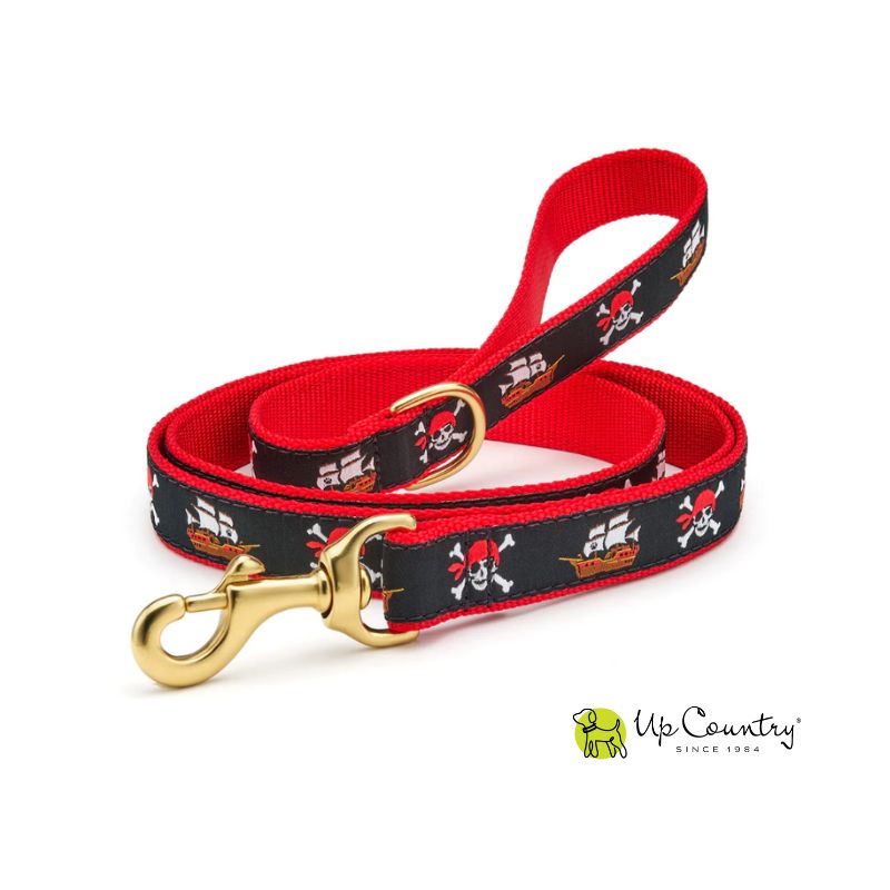 Pirate-themed dog leash with red and black design on red webbbing with brass hardware on a white background, featuring the Up Country brand logo.
