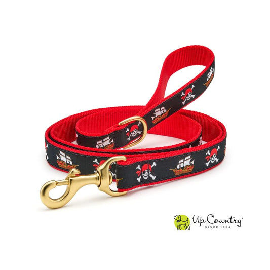 Pirate-themed dog leash with red and black design on red webbbing with brass hardware on a white background, featuring the Up Country brand logo.